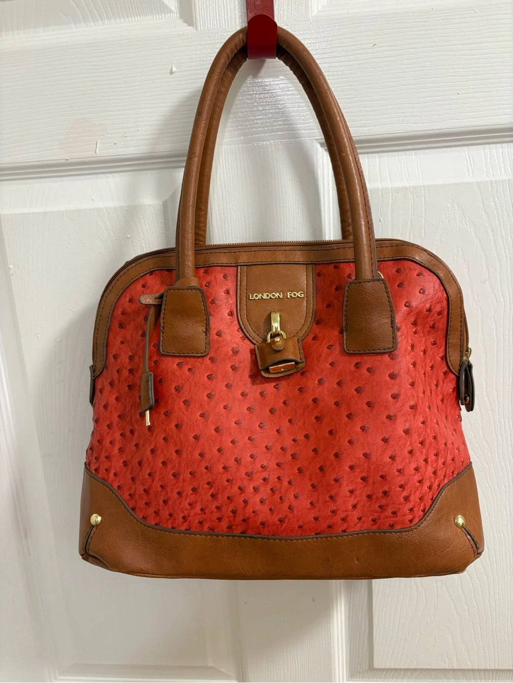 London Fog satchel features a distinctive red ostrich print and lock& key